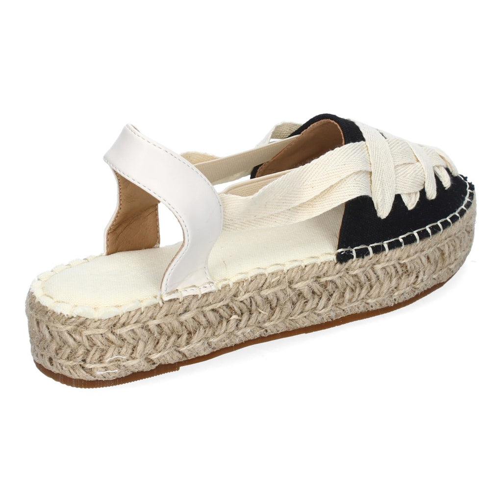 Vista trasera de alpargata negra con tira al tobillo blanca