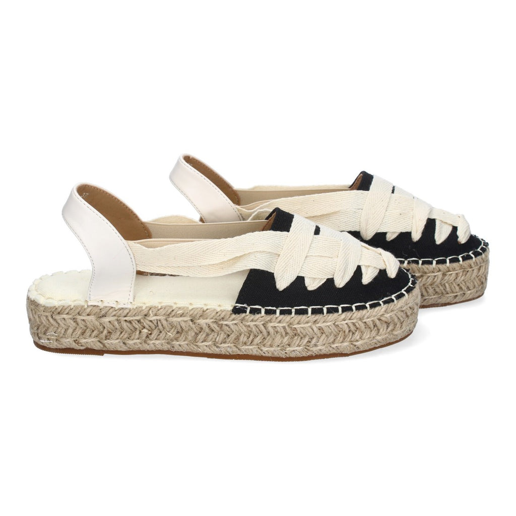 Alpargatas negras con plataforma de yute y detalle de cintas cruzadas